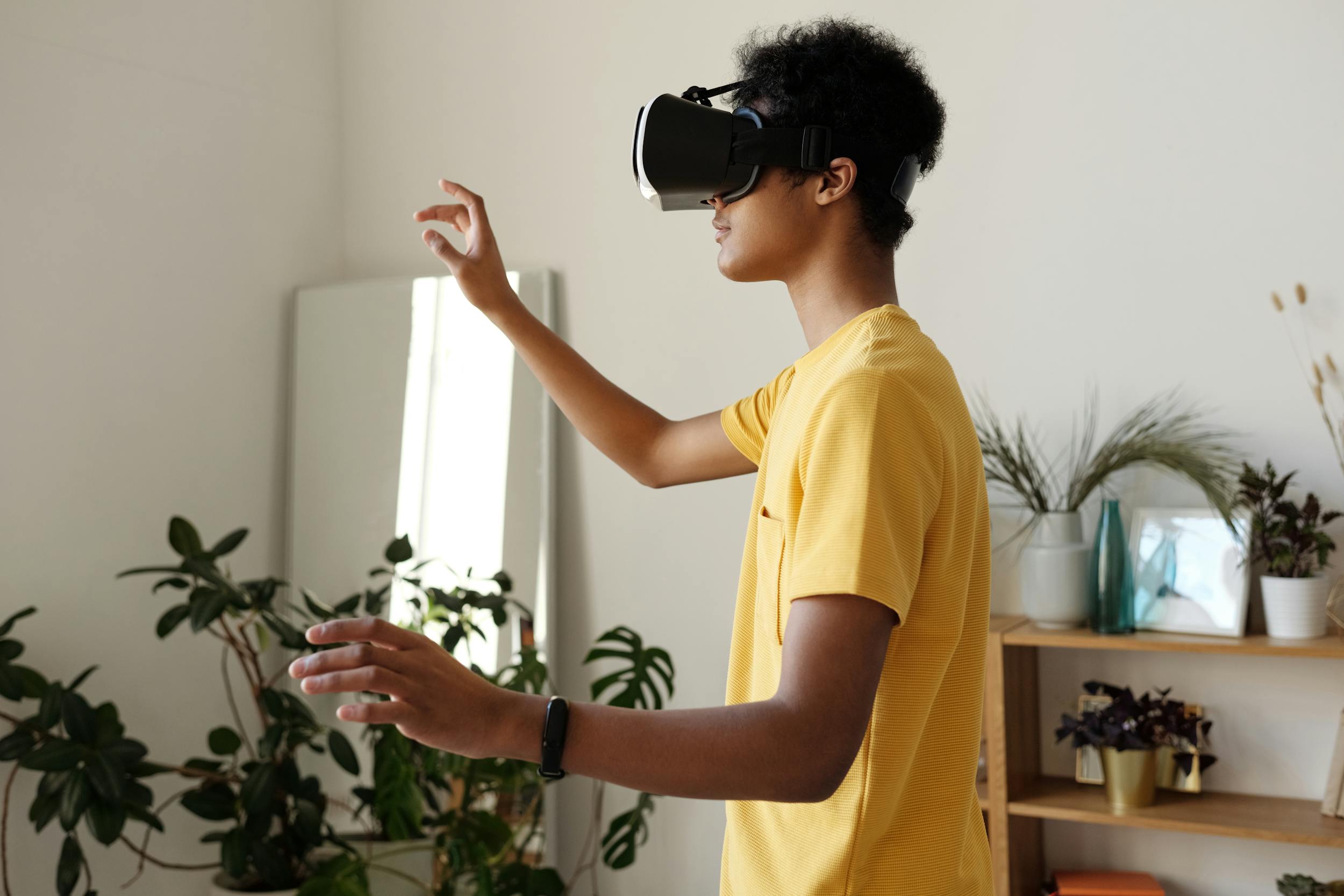 man playing virtual reality VR in room reaching u