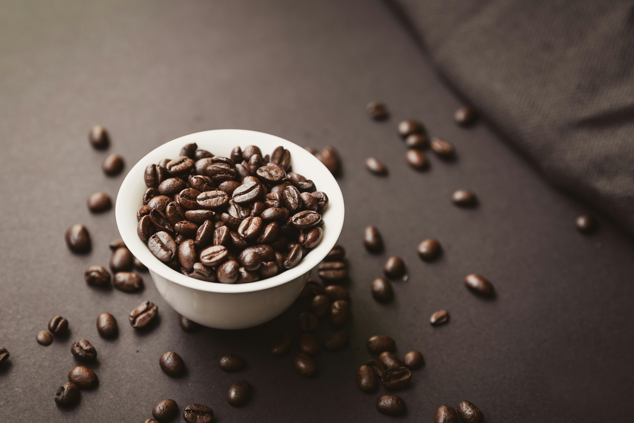 Coffee beans in white bowl